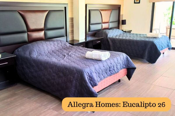 Spacious bedroom with two double beds at Allegra Homes Eucalipto 26 in Cuernavaca, perfect for groups staying for the World Cup 2026.