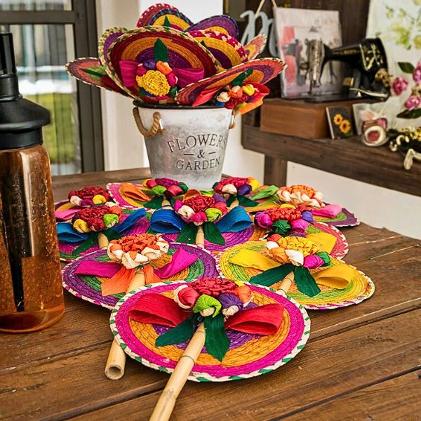 Stylish guests at an international wedding in Jardín Allegra, posing in front of illuminated AK letters