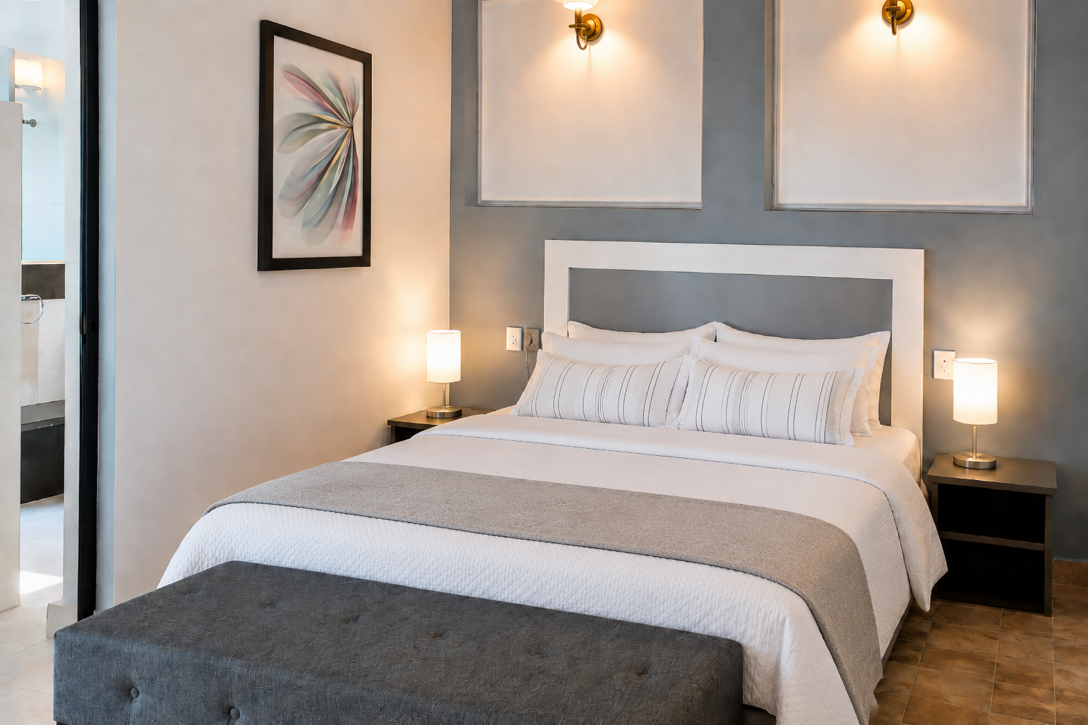 Recámara 3 de Allegra Suites con cabecera tapizada gris, buros de madera con lámparas y arte de pared, Allegra Homes en Cuernavaca, Morelos